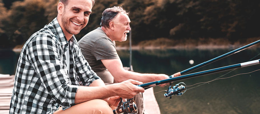 Two people smiling and fishing